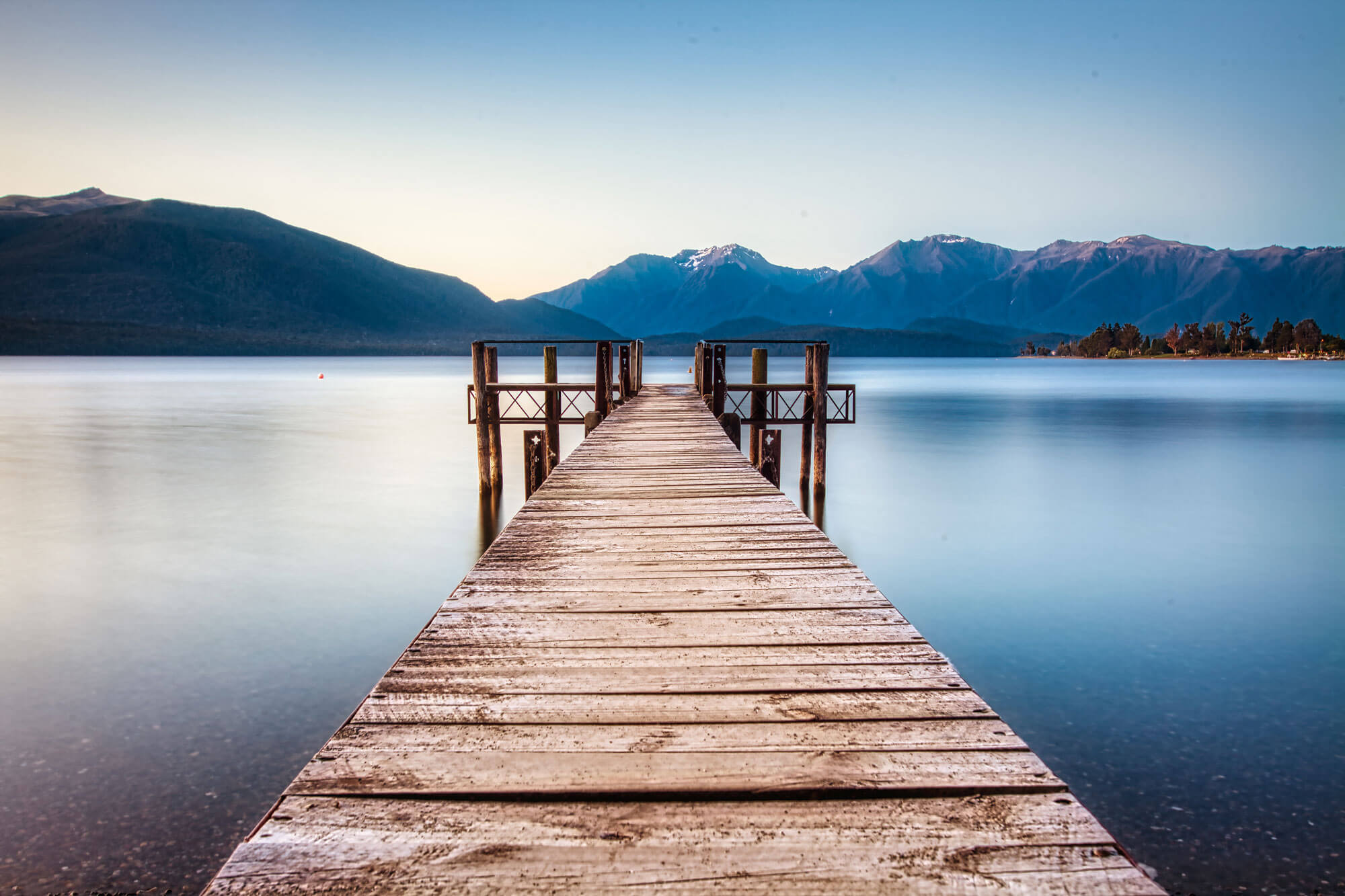 te anau scenery wharf mountain range lake